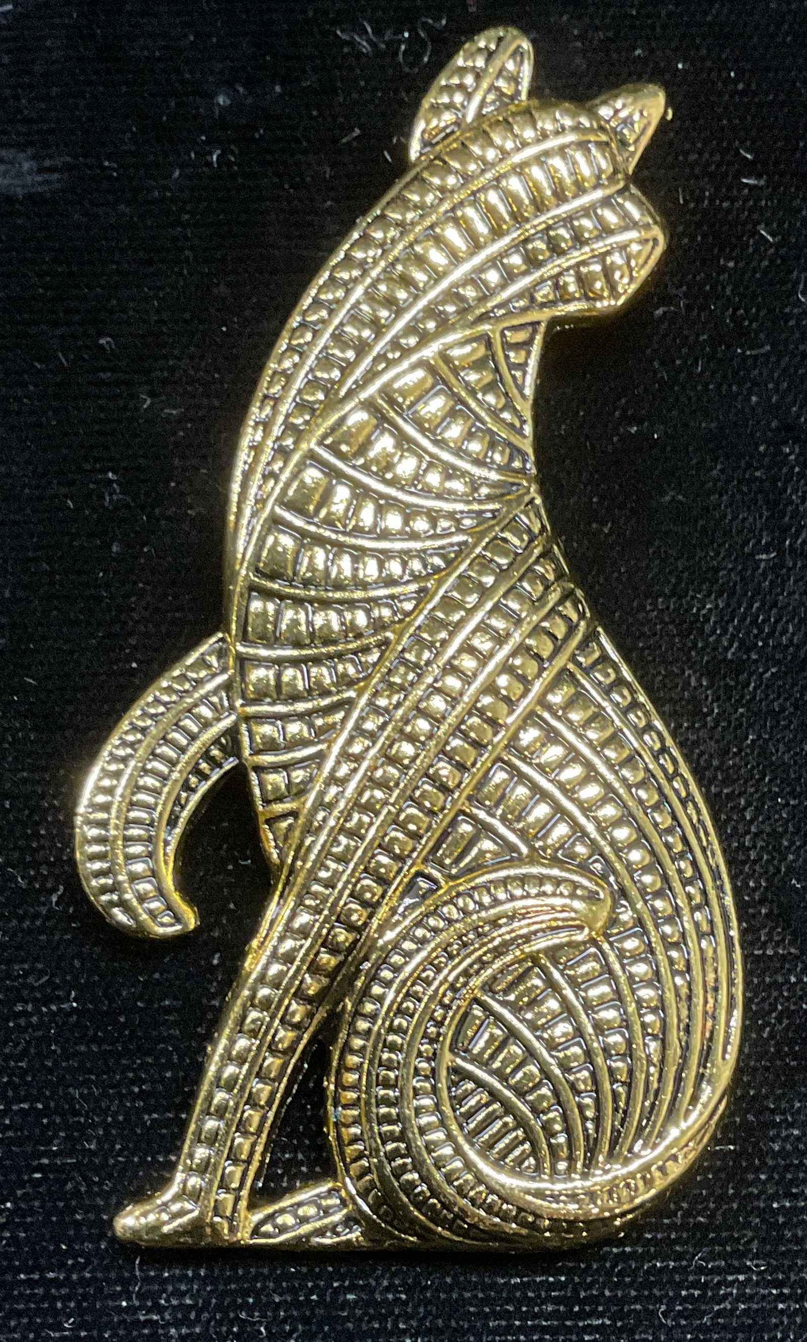 Gold Tone Celtic Cat Brooch, 2.75 in L: Gold tone Celtic cat motif brooch with raised detail. Hinge pin on underside. Measures approx 2.75 x 1.5 inches. Some wear including scratching. Jewelry, estate jewelry, costume jewelry, cocktail jewe