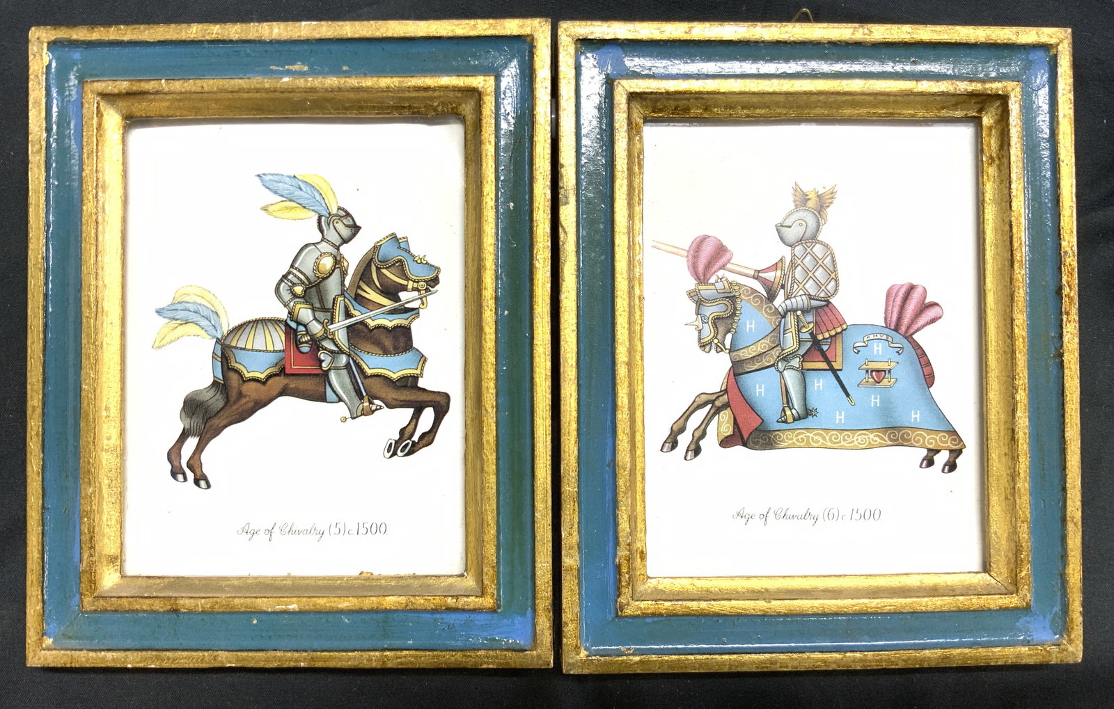 Lot 2 AGE OF CHIVALRY Framed Prints Italy: Lot includes 2 prints. Each read AGE OF CHIVALRY. Each print has depiction of knight on horseback. Prints each have giltwood and teal frames. Backsides have tags which read IMPORTS UNLIMITED MADE IN I