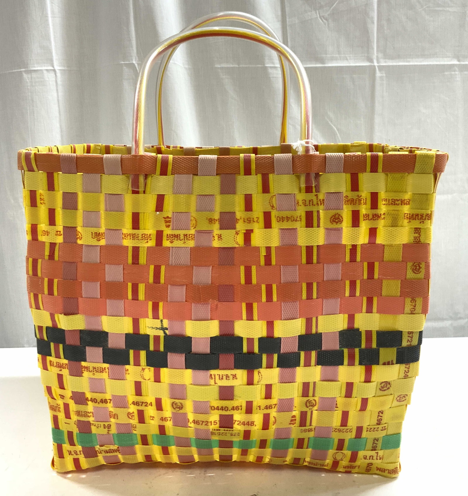 SMITH & HAWKEN Woven Tote Easter Basket W Handles: Tag reads SMITH & HAWKEN. Tote basket is woven. Piece has multiple tones. Basket has arch form handles at sides. Piece measures approximately 18 inches tall 15 inches wide 9 inches deep. Basket, tote 