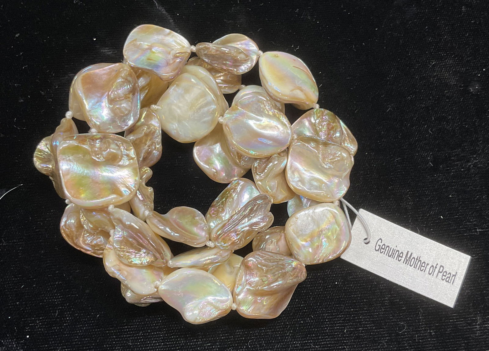 Off White Mother of Pearl Beaded Necklace NWT: Off white to beige toned mother of pearl beaded necklace on double knotted string. Drop length approx 13.5 inches. New with tag. Jewelry, costume jewelry, estate jewelry, fashion jewelry, cocktail jew