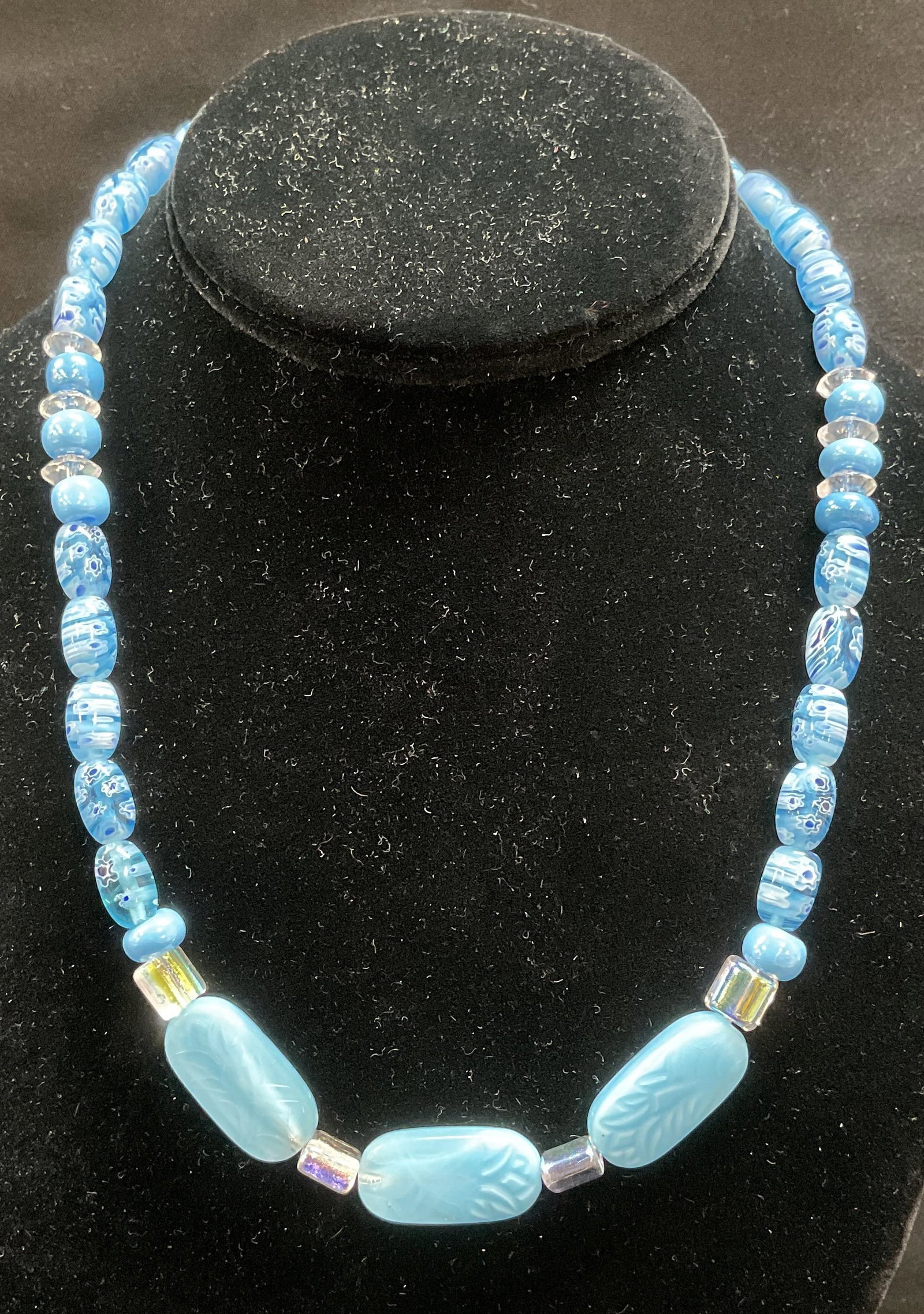 Blue Beaded Art Glass Millefiori Necklace: Blue toned beaded art glass necklace with millefiori floral beads and crystal accents. Drop length approx 8 inches. Jewelry, costume jewelry, estate jewelry, fashion jewelry, cocktail jewelry, accesso