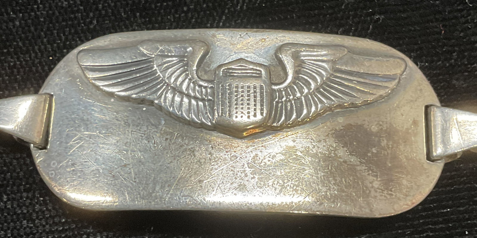Vintage Bell Sterling Silver Shield Bracelet: Vintage Bell Sterling silver chain bracket with raided winged shield motif on panel. Signed on underside. Marked sterling. Measures approx 7 inches long. Total weight .80 ozt. Some wear including scra