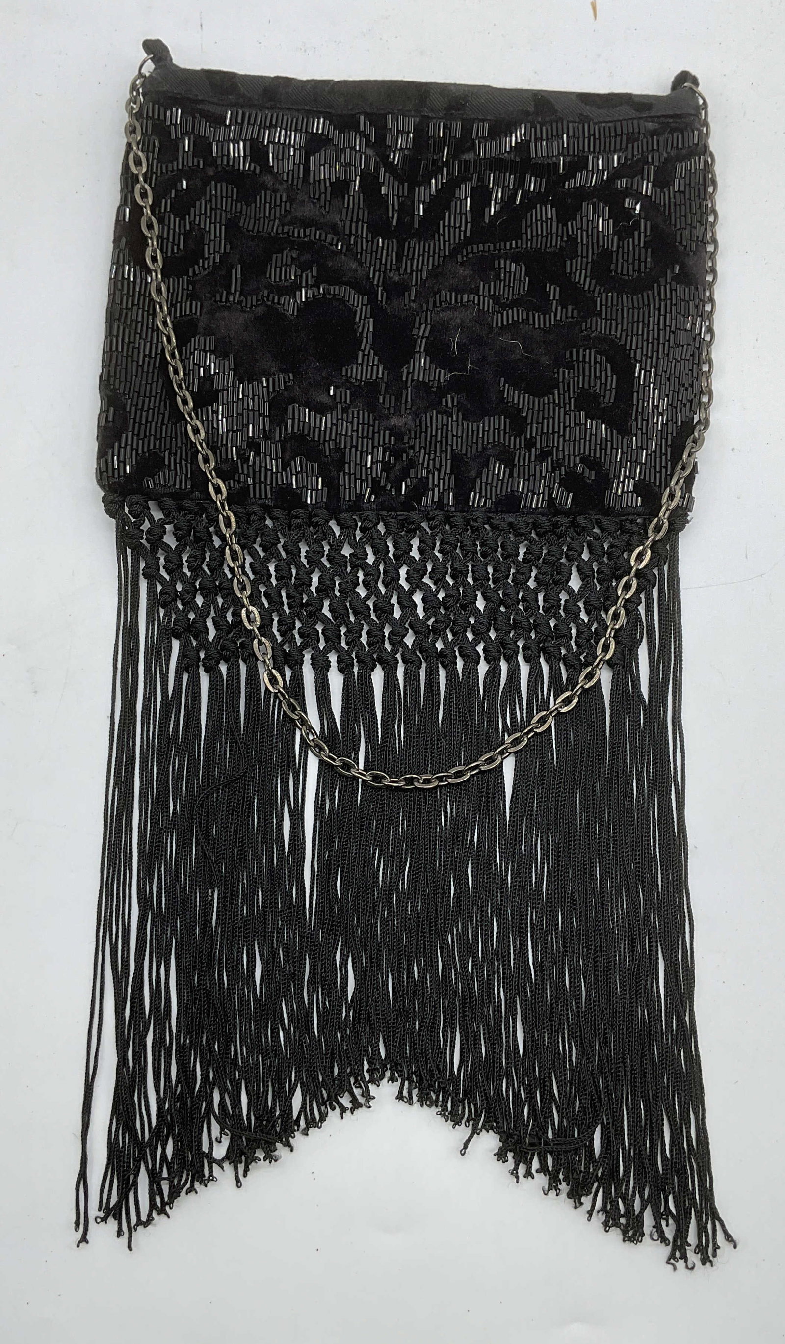 Chicos Black Velvet Beaded Handbag: Chicos black velvet beaded handbag with fringe. Synthetic material, signed on interior. Measures approx 8 x 6 inches. Fringe approx 9 inches long. Some wear consistent with exposure. Chicos handbag, d