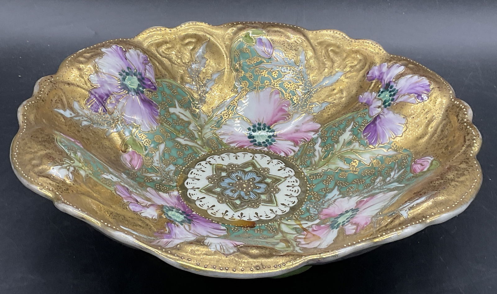 ROYAL HINODE NIPPON Vintage Hand Painted Bowl: ROYAL HINODE NIPPON Vintage Hand Painted Bowl. Florals throughout the piece. Gilt accents and raised details to the design. Underside signed ROYAL HINODE NIPPON. Measures approx. 3H x 10.5W in. Losses