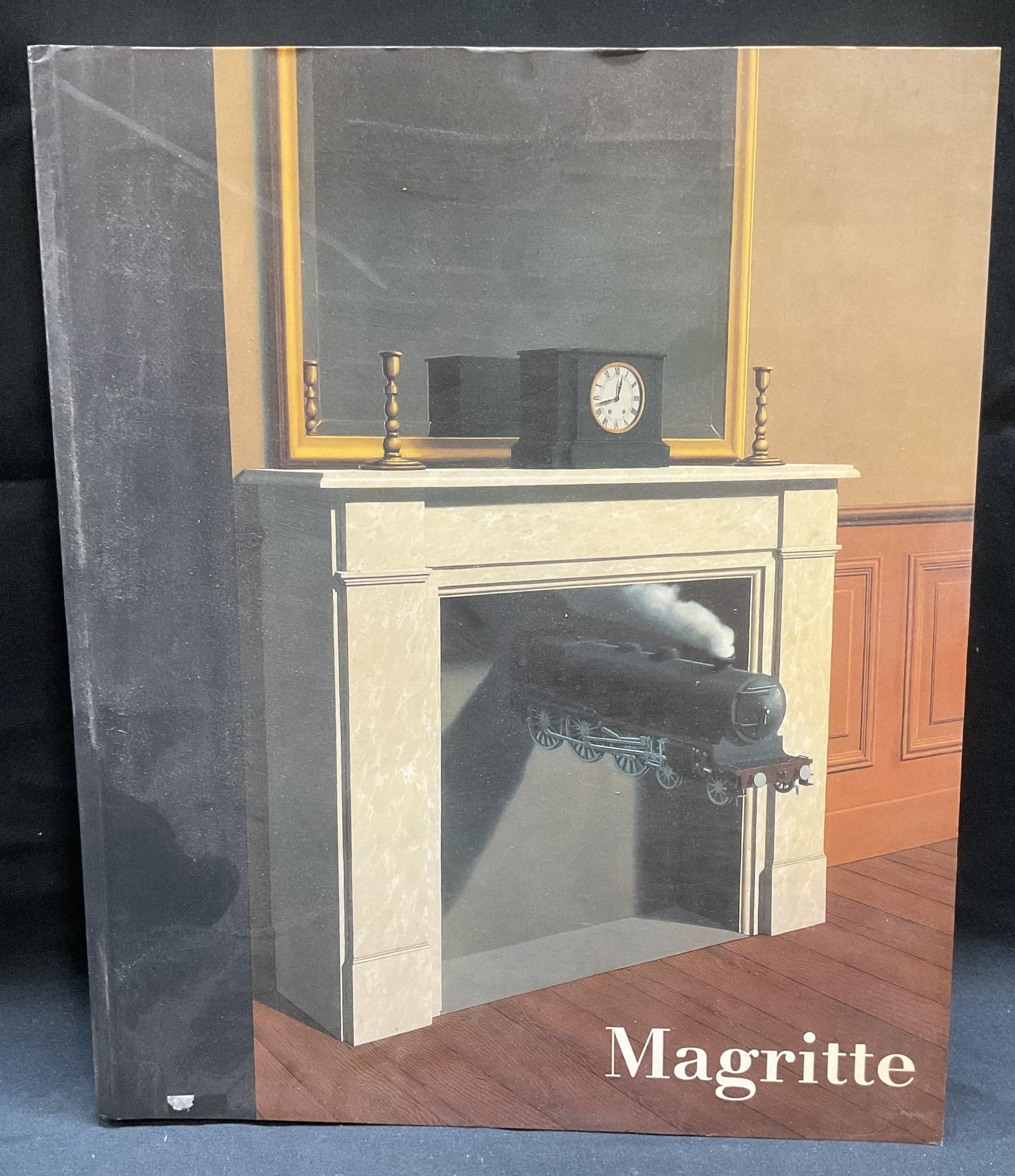 1992 Magritte, Surrealist Art Book, Illustr: Softcover copy of Magritte by Sarah Whitfield. Published by The South Bank Centre, 1992. Illustrated. Measures approx 11 x 9 inches. Some wear to cover, pages, and binding consistent with exposure. Ma