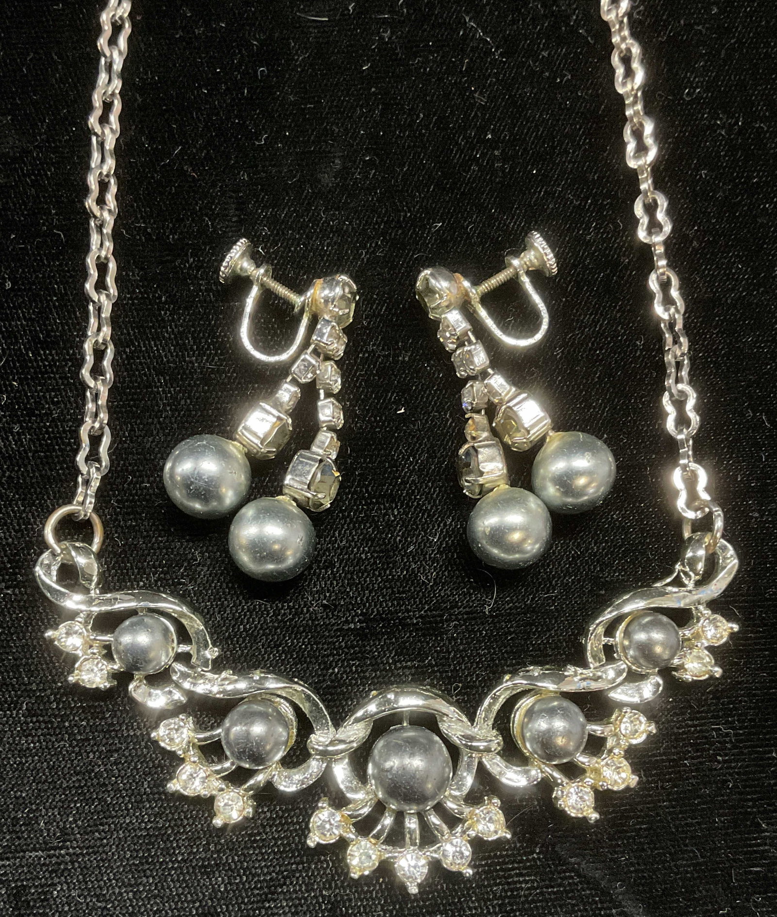 Lot 2 Vtg Faux Pearl Crystal Earrings & Necklace: Lot of 2 vintage silver tone earrings and pendant necklace with faux pearl and crystal decoration. Necklace drop length approx 6.5 inches. Earrings approx 1.5 inches long. Some wear to both pieces inc