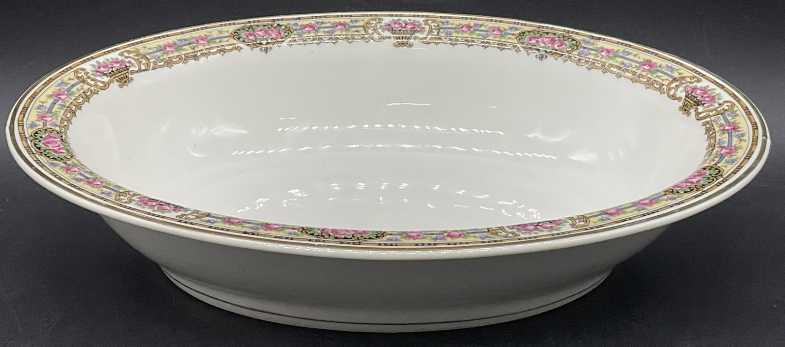 CH FIELD HAVILAND LIMOGES Porcelain Serving Bowl: CH FIELD HAVILAND LIMOGES Porcelain Serving Bowl. Floral motif design. Underside signed CH FIELD HAVILAND LIMOGES. Measures approx. 2.25H x 10W in. Surface wear consistent with age, use, and exposure.