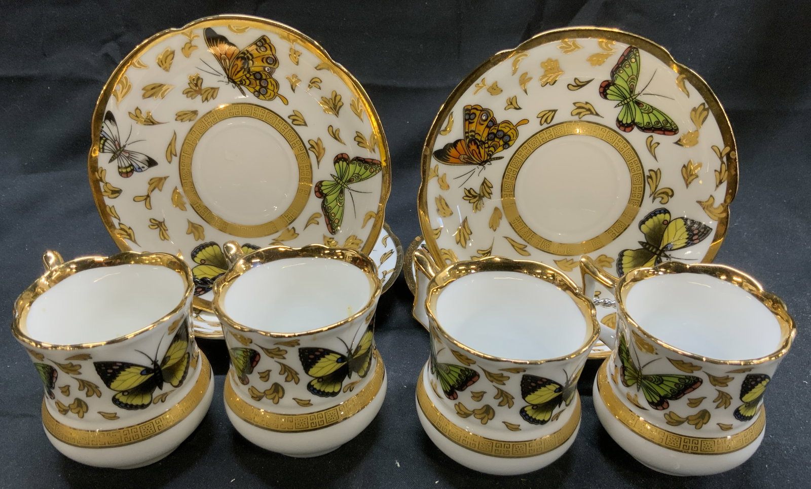CC&T Lot 8 Porc Teacups & Saucers: Undersides are marked CC&T. Lot includes 4 saucers & 4 teacups. Each piece is white with gilt and multi toned butterfly, & leaf detail. Saucers measure approximately 4.75 inches diameter. Teacups, sau