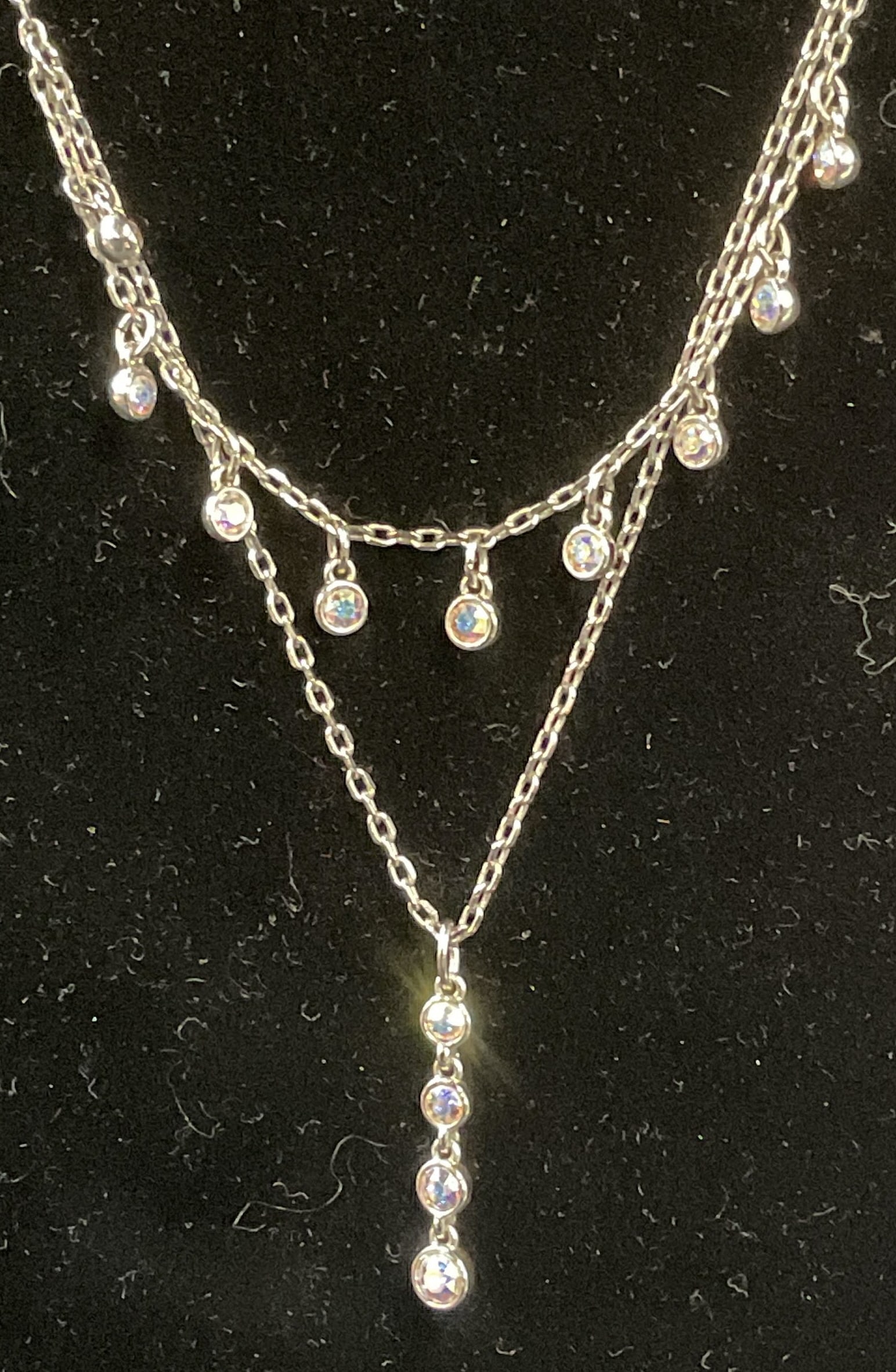 Swarovski Touchstone Crystal Pendant Necklace: Touchstone by Swarovski silver tone pendant necklace with Swarovski crystal decoration. Signed on hang tag. Drop length approx. 9 inches. Some surface wear including scratching observed. Jewelry, esta