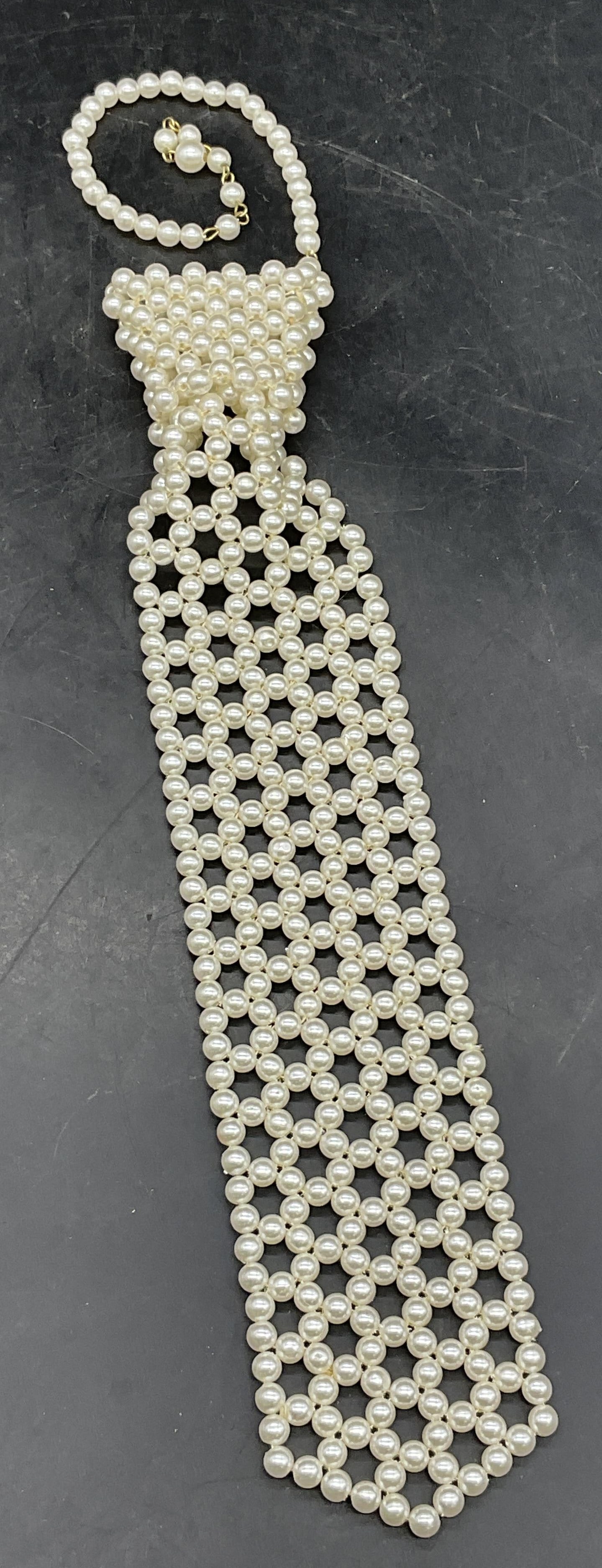 Vintage Pearlescent Bead Tie Motif Necklace: Vintage Pearlescent Bead Tie Motif Necklace. Length measured end to end approx. 19 inches. Needs repair, missing pieces. Surface wear consistent with age, use, and exposure. Vintage jewelry, Vintage a