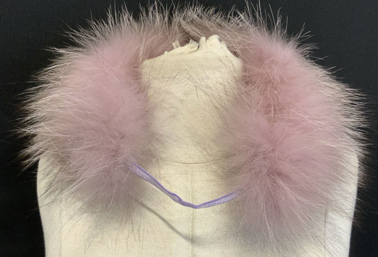 Mauve Faux Fur Scarf Wrap: Scarf wrap is mauve toned. Piece is crafted from faux leather. Scarf wrap includes plastic hanger clip. Piece measures approximately 10.5 inches diameter. Scarf, scarf wrap, faux fur scarf wrap, mauve