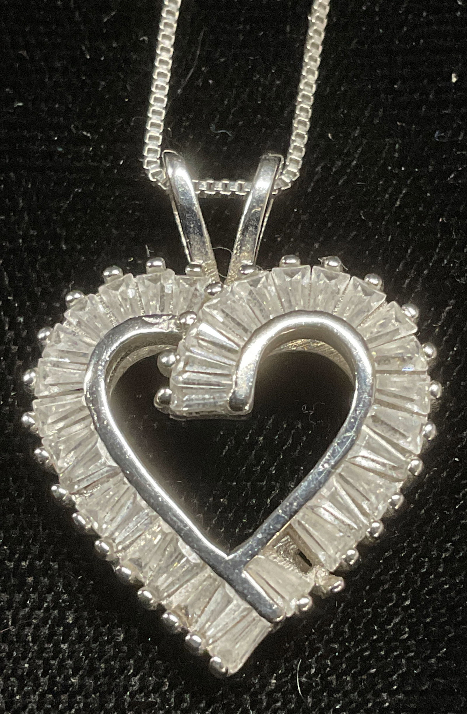NC Sterling Silver Crystal Heart Pendant Necklace: NC Sterling silver necklace with colorless crystal decorated heart pendant, marked 925. Signed NC. Drop length approx 8.75 inches. Pendant approx .75 inches long. Total weight 4.7 grams. Some wear inc