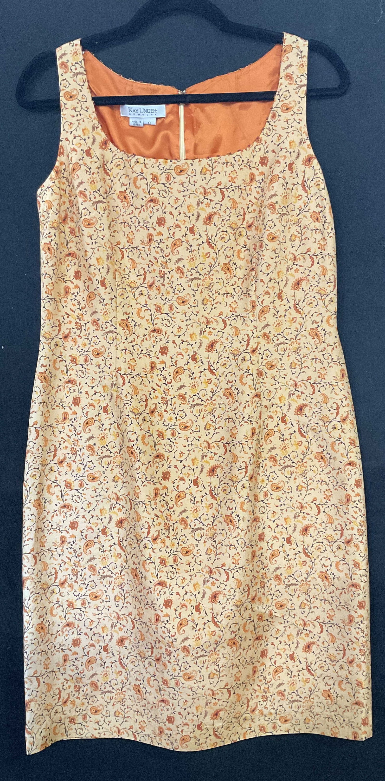 KAY UNGER NWT Silk Orange Floral Paisley Dress: KAY UNGER 100% Silk Orange Floral Paisley Dress. Zipper closure to the reverse. Measured flat approx. 38 inches in length. Original tag attacked reads KAY UNGER, SIZE 8, 100% SILK. Some surface wear c