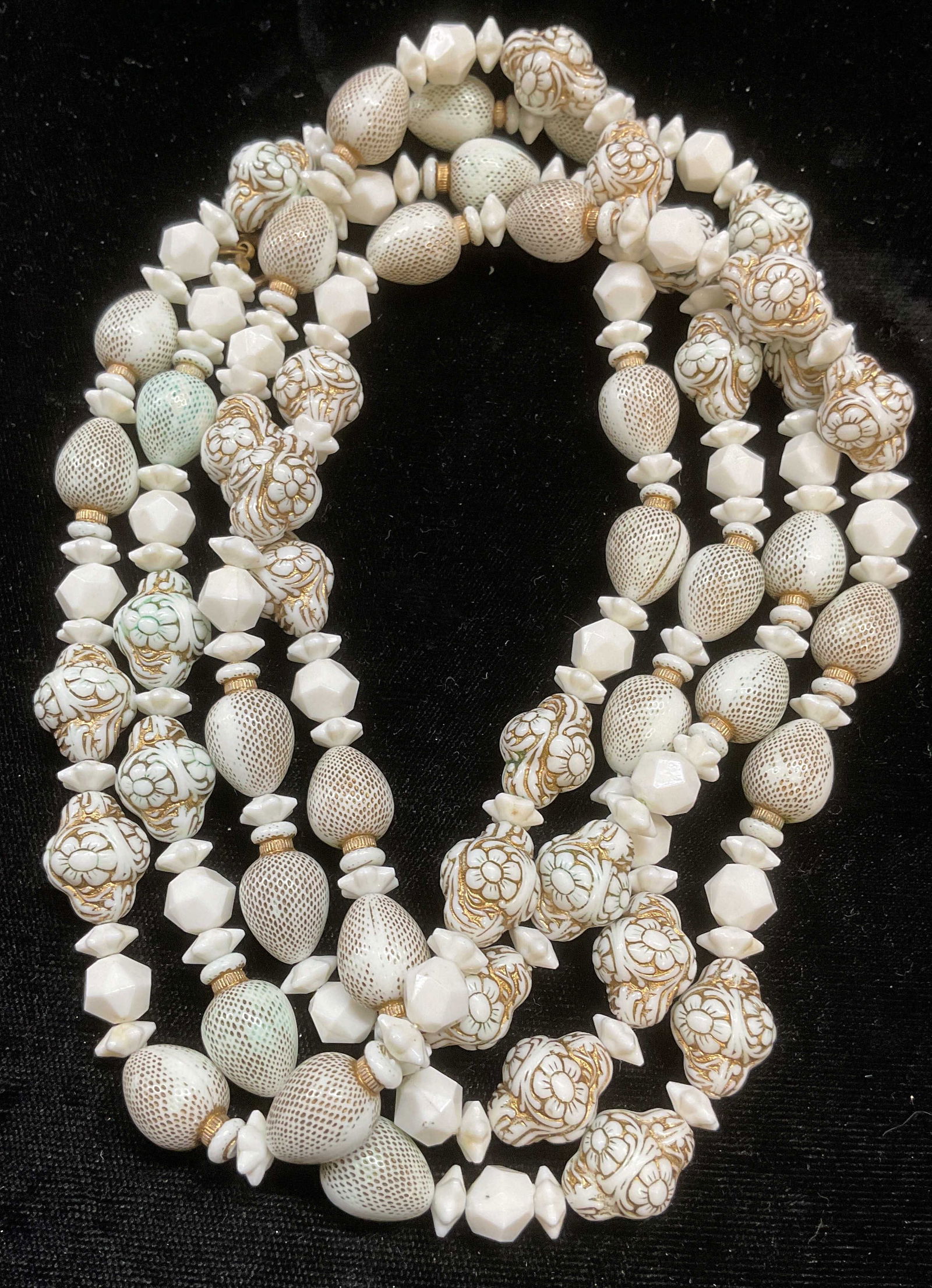 Vintage Gilt White Floral Beaded Necklace: Vintage gilt white beaded necklace with floral motif. Drop length approx 26 inches. Some wear including scratching observed. Jewelry, estate jewelry, costume jewelry, cocktail jewelry, fashion jewelry