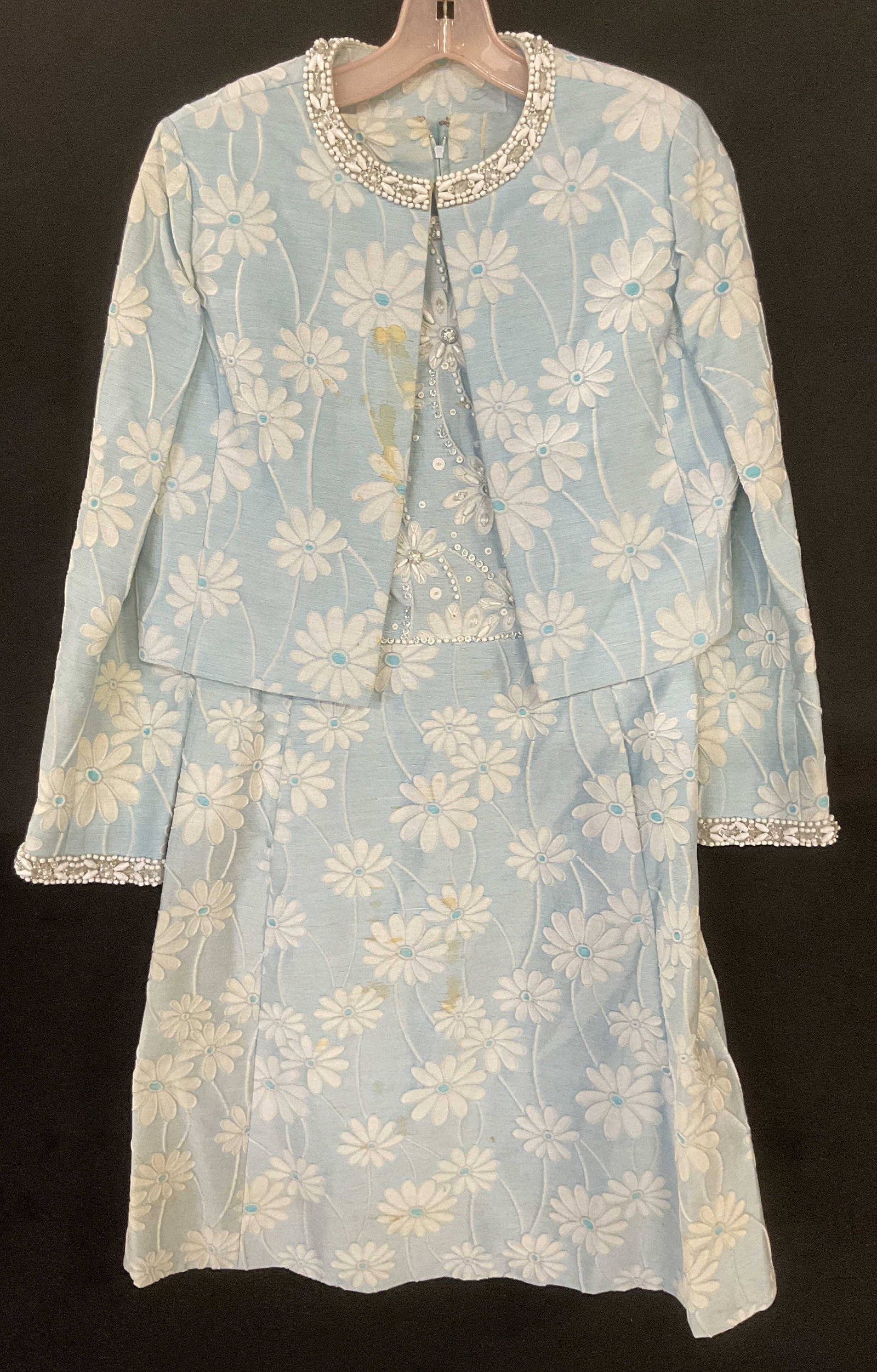 Vintage Blue Floral Bejeweled Dress & Jacket: Vintage blue and white floral pattern sleeveless dress and matching jacket with bejeweled colorless and white crystal decoration. Dress measures approx 17 inches across chest, 14 inches across waist. 