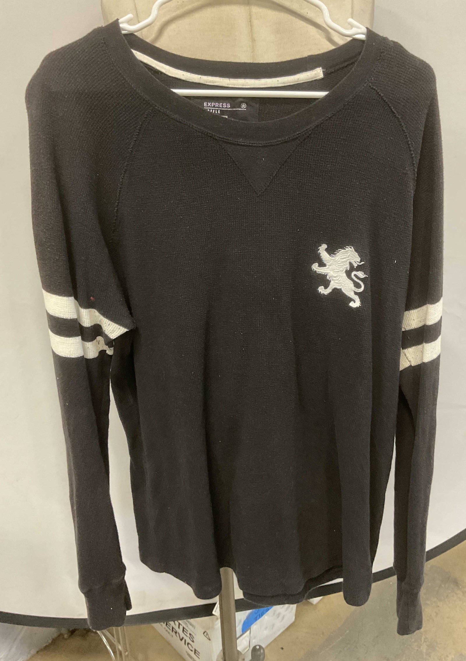 Express Black Waffle Knit Lion Top: Express black waffle knit long sleeve top with striped sleeve detail and lion applique. Size xl. Cotton blend. Wear to material including fading. Express, express top, long sleeve top, black top, waff