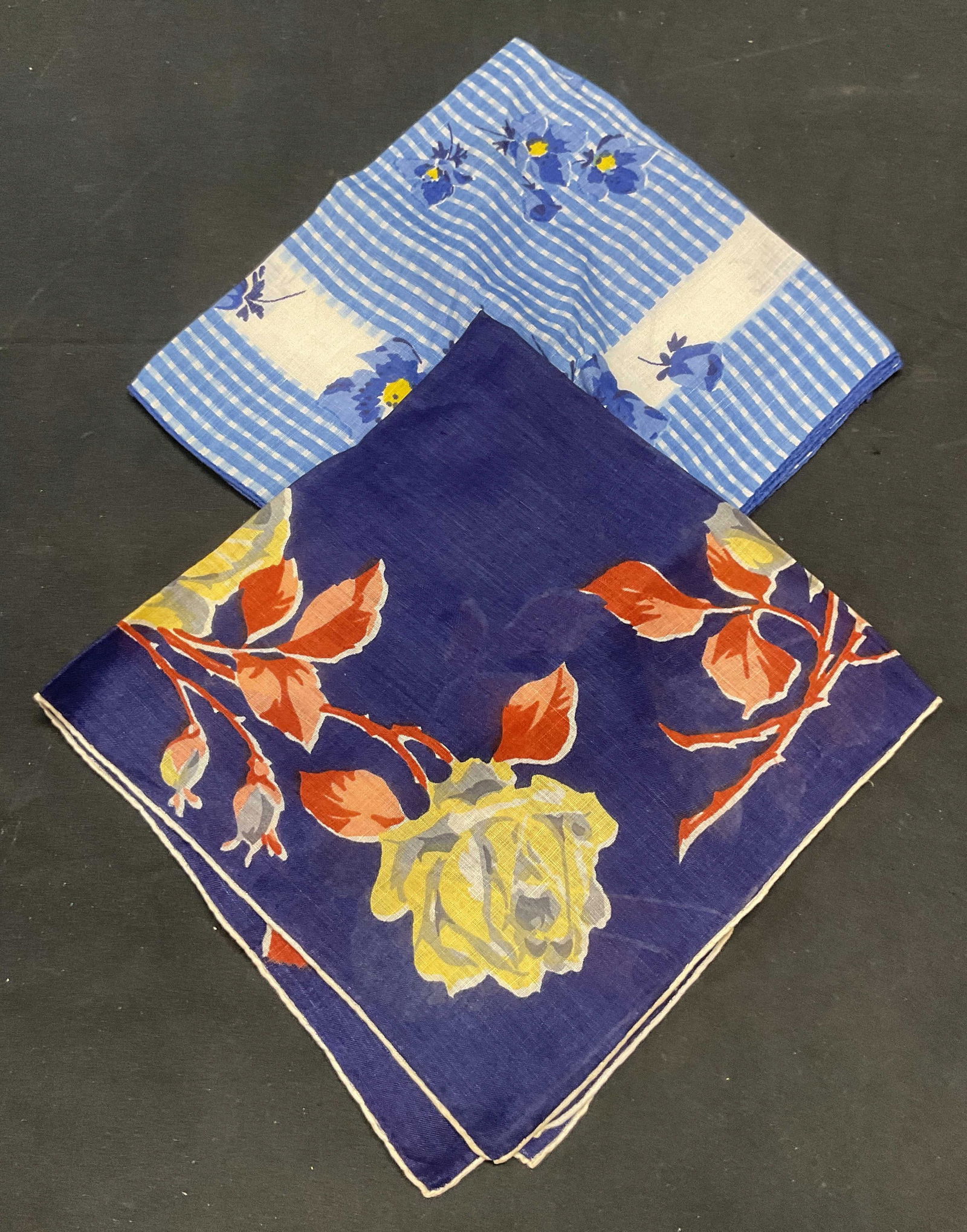 Lot 2 Vintage Blue Floral Handkerchiefs: Lot of 2 blue floral pattern handkerchiefs. Feels like cotton. Larger measures approx 14 x 14 inches. Some wear to each including blemishes observed. Handkerchief, vintage handkerchief, blue handkerch