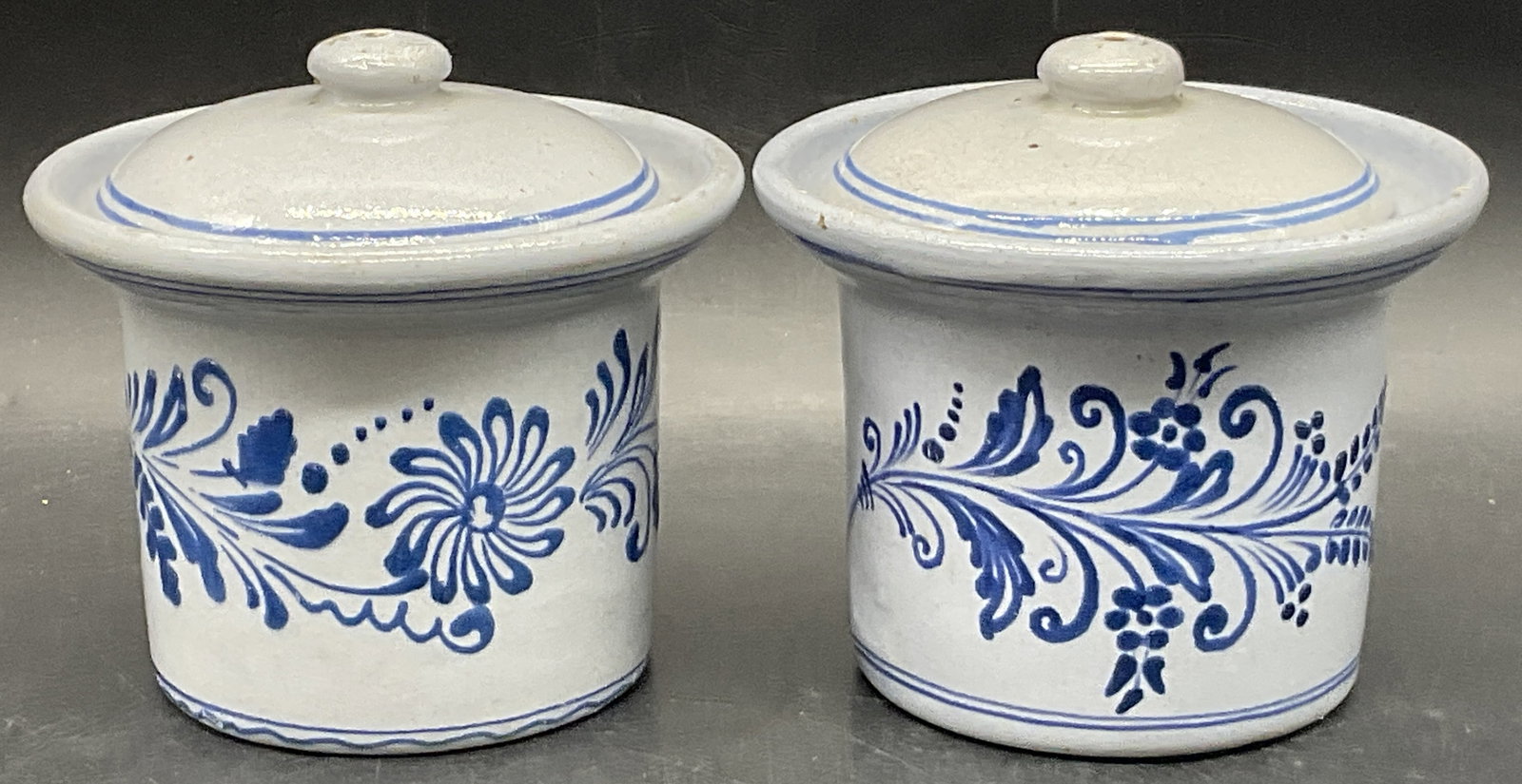 Lot 2 Vintage Hand Painted Pottery Vessels, Lidded: Lot 2 Vintage Hand Painted Pottery Vessels. Lidded. Blue hues throughout. Measures approx. 5H x 4.5W in. Chipping, pitting, crazing, discoloration, and surface wear present. home decor, home accents, 