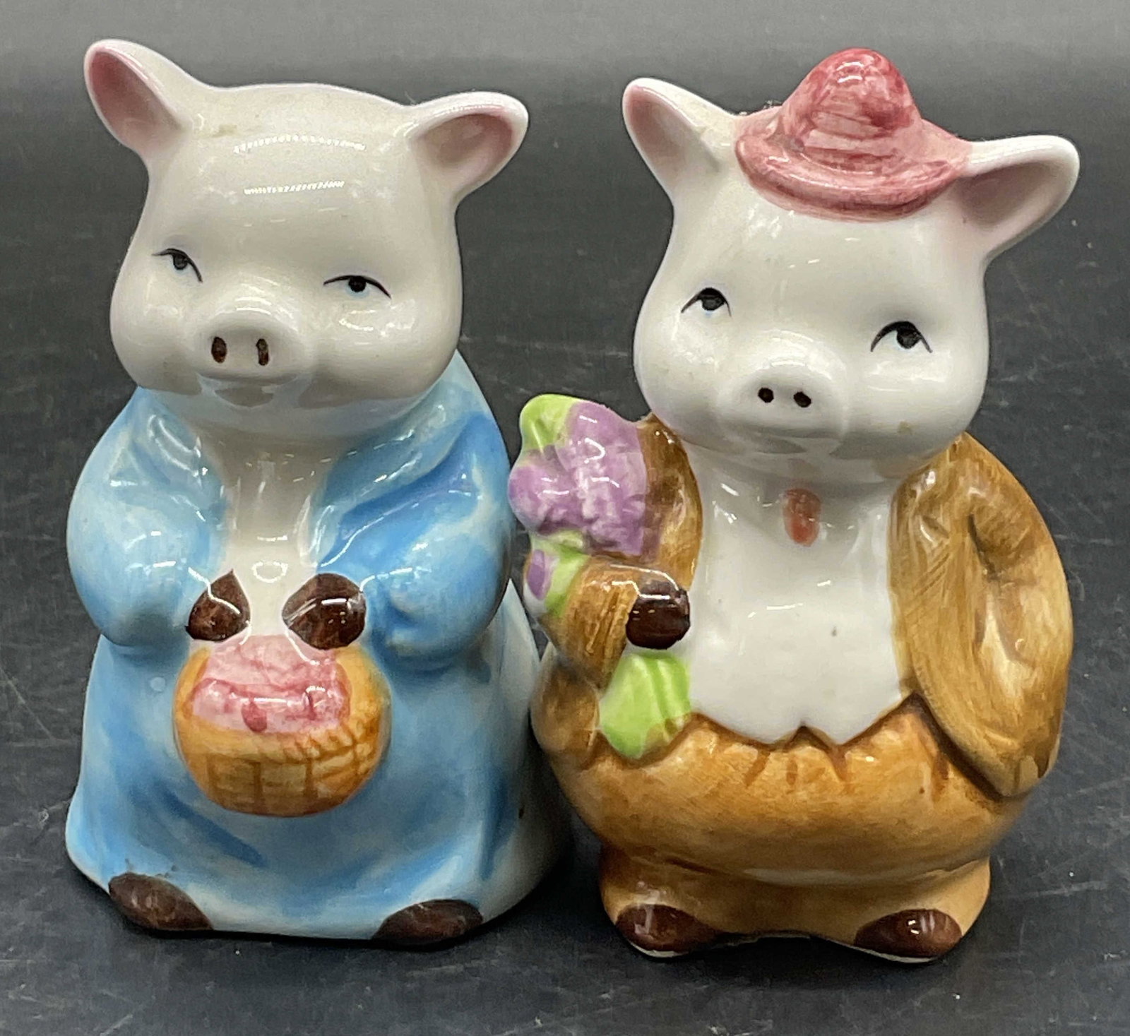 RDG Ceramic Anthropomorphic Pig Salt&Pep Shakers: RDG Ceramic Anthropomorphic Pig Salt & Pepper Shakers. Underside is marked RDG. Stopper to one underside. Measures approx. 3.25H x 2W in. Crazing, pitting, cracking, and surface wear present. home dec