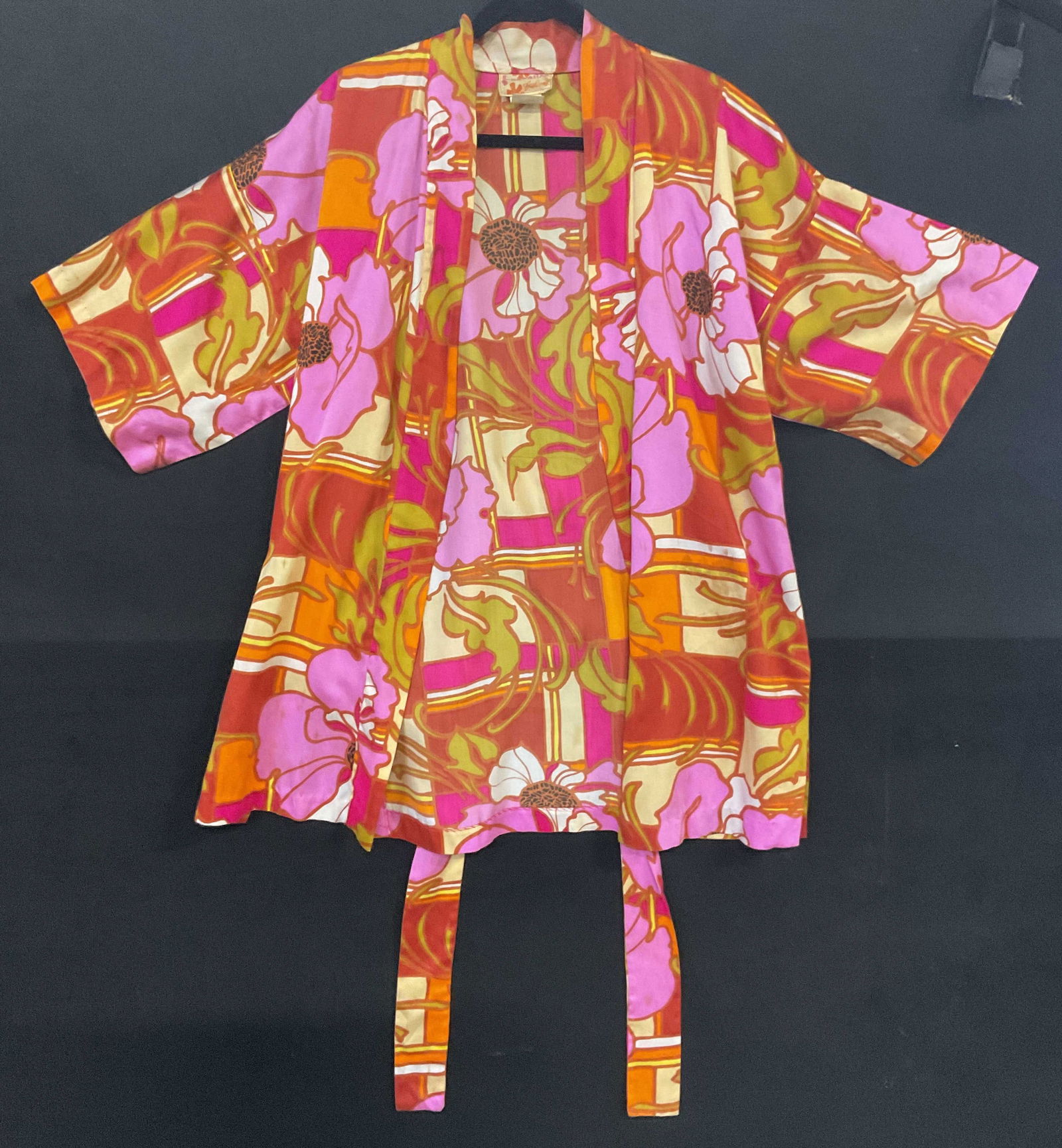 SEARS HAWAIIAN FASHIONS Floral Cardigan / Robe: SEARS HAWAIIAN FASHIONS Floral Cardigan / Robe. Fabric tie belt attached at reverse. Crafted from soft hand material. Length measured flat approx. 33 inches. Across chest measured flat approx. 20 inch