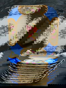 GOLD CASTLE Set 11 Vntg Porcelain Plates JAPAN: Undersides are marked GOLD CASTLE MADE IN JAPAN. Lot includes 11 plates. Each have intricate multi toned floral and leaf detail surrounded by ornate scrolls and blue toned corners. Each plate is
