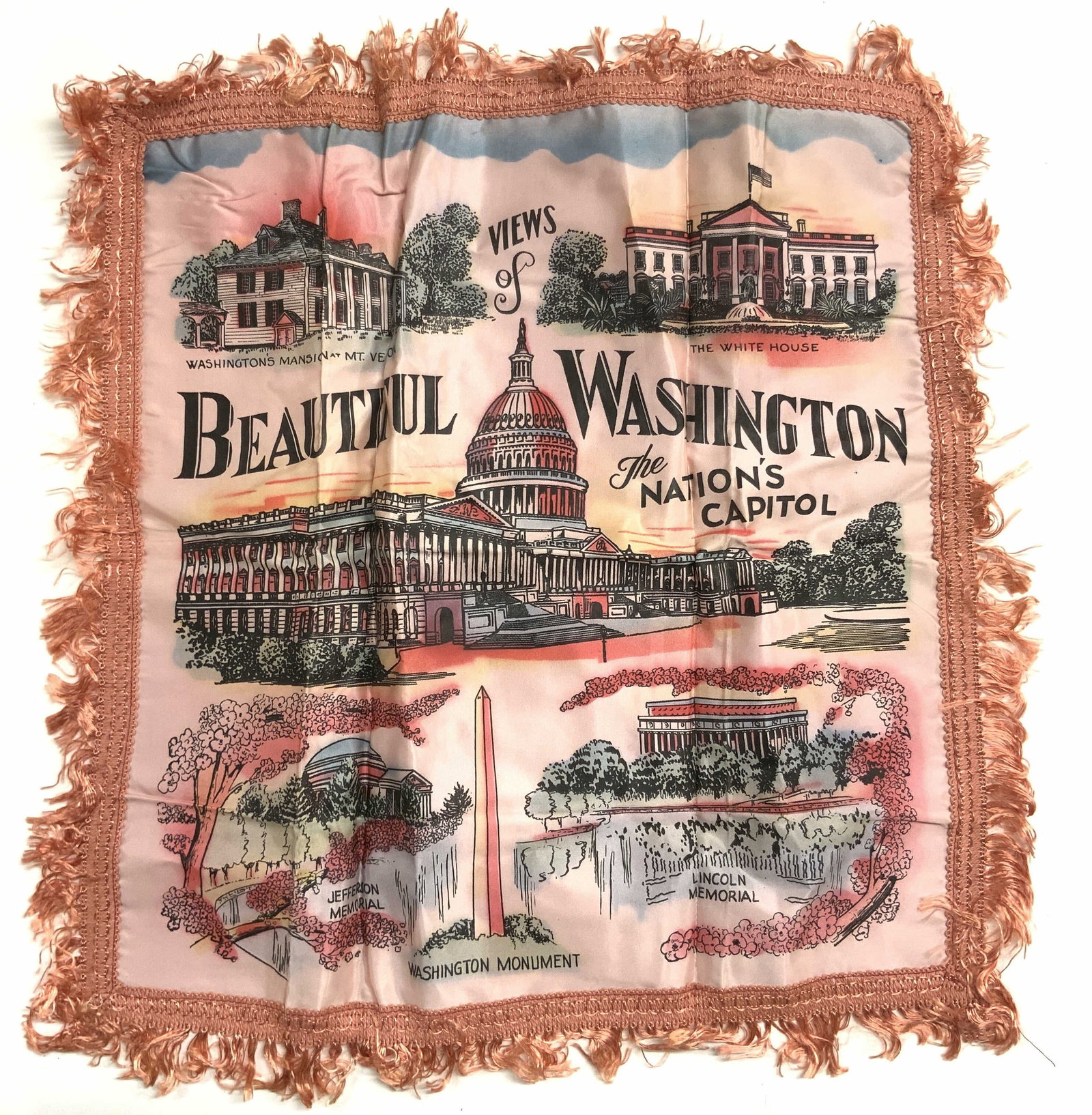 Vntg Washington DC Fringed Pillow Cover: Pillow cover is vintage. Piece is pink toned with fringes at edges. Piece has multiple depictions of Washington DC tourist sites. Pillow cover measures approximately 19 inches square. Pillow cover, Wa