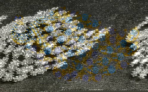 Gold Tn Blue Crystal Peacock Brooch, 3 in L: Gold tone peacock motif brooch with blue crystal decoration. Hinge pin on underside. Measures approx 3 x 1.5 inches. Some wear including scratching. Jewelry, estate jewelry, costume jewelry,