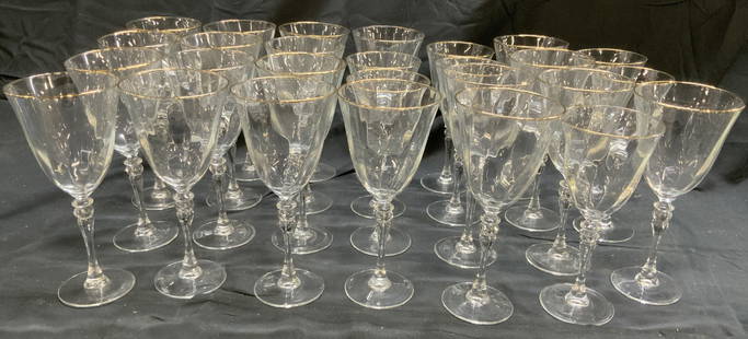 Set 27 Gilt Rim W Glass Wine Goblets: Lot includes 21 larger goblets & 6 smaller goblets. Each piece is glass with swirl optic basins. Pieces each have gilt rims. Each piece has stem with circular form base. Larger goblets measure