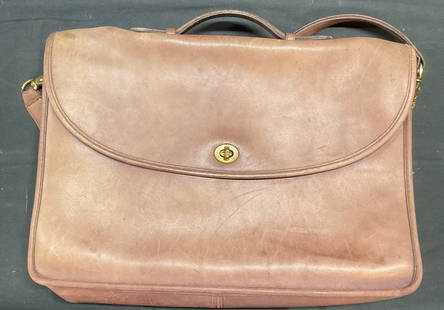 Vintage Coach Brown Leather Briefcase Handbag: Vintage Coach brown leather briefcase handbag. Signed on interior, brass hardware, fold over flap with turn lock. Measures approx 15 x 3 x 10 inches. Wear including scratching, scuffing, and