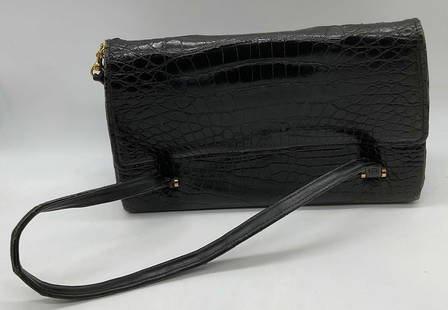 Vintage Black Croc Embossed Leather Handbag: Vintage black croc embossed leather handbag. Velvet lined interior with 2 pockets. Measures approx 11.5 x 3.5 x 7 inches. Wear including, scratching, rubbing, edge wear, and blemishes observed.