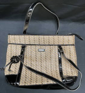 Nine & Co Woven Faux Patent Leather Handbag: Nine and Co tan woven straw and faux black patent leather trim handbag. All man made material. Signed on exterior and interior. Measures approx 13 x 3.5 x 10.5 inches. Nine and co handbag,