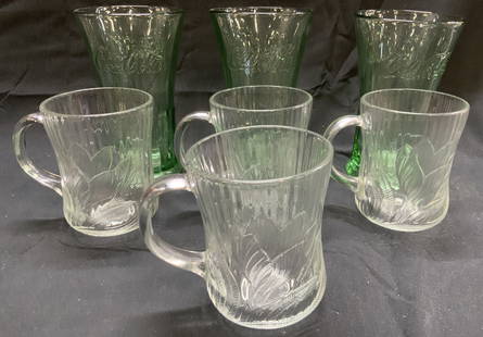 Lot 7 Coca Cola Glass Cups & More: Lot includes 3 Coca Cola cups & 4 glass mugs with handles and leaf detailing. Each Coca Cola cup measures approximately 6.25 inches tall 4 inches wide. Cups, vessel, mugs, Coca Cola cups,