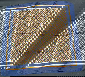 GIVENCHY Blue Geometric Striped Silk Scarf: GIVENCHY geometric diamond striped print silk scarf in blue, orange, and white. Signed on corner. Hand rolled edges. Measures approx 18 x 18 inches. Wear including blemishes observed. GIVENCHY,