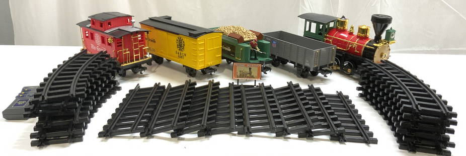 Set 27 Model Train & Track Pieces SCIENTIFIC TOYS: Underside of steam engine reads SCIENTIFIC TOYS INC. Lot includes 5 train carts, 8 straight track sections, 12 curved track sections, 1 sign & 1 remote. Steam engine measures approximately 13.5
