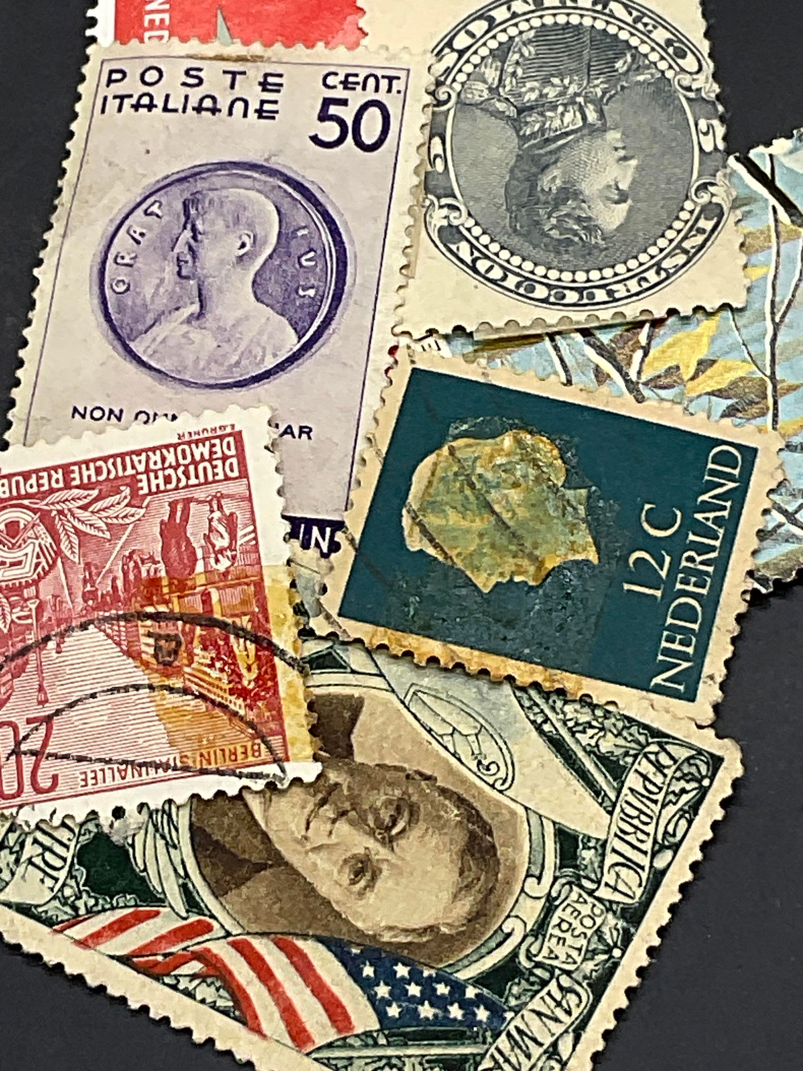 Group Lot 50+ Vintage Stamps & Ephemera: Group Lot 50+ Vintage Stamps & Ephemera. Some are USA and some are foreign. Plastic sleeve containing stamps measures approx. 9W x 11.5W in. Pieces are not individually examined. Discoloration, losses