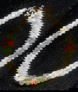 Vintage Mother of Pearl Semiprecious Bracelet: Vintage twisted multi strand bracelet with mother of pearl, coral, and semiprecious green stones. Gold tone accents. Measures approx 7 inches long. Some wear including scratching observed.