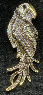 Gold Tone Crystal Bird Brooch, 3.25 In Long: Gold tone multicolor Crystal decorated bird motif brooch. Hinge pin on underside. Measures approx. 3.25 x 1.25 inches. Some wear including scratching observed. Jewelry, estate jewelry, costume