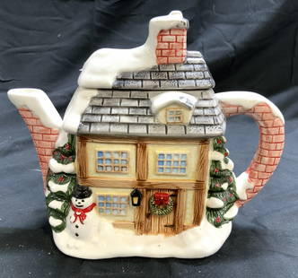 House Form Porcelain Teapot W Lid Cottageware: Teapot is porcelain. Piece has house form with Christmas decorations & snow on roof. Teapot includes lid. Front of piece has snowman. Teapot measures approximately 8 inches deep 7 inches tall 4.5