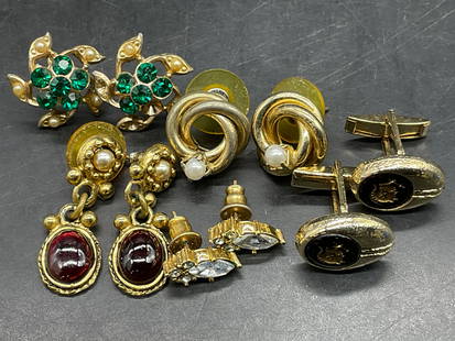 5 Vintage Crystal Earrings & Enameled Cufflinks: Four pairs of gold tone metal earrings featuring costume cabochons, pearlescent beads, or crystals. One pair of gold tone metal cuff links featuring black enamelwork. Floral form earrings with green f