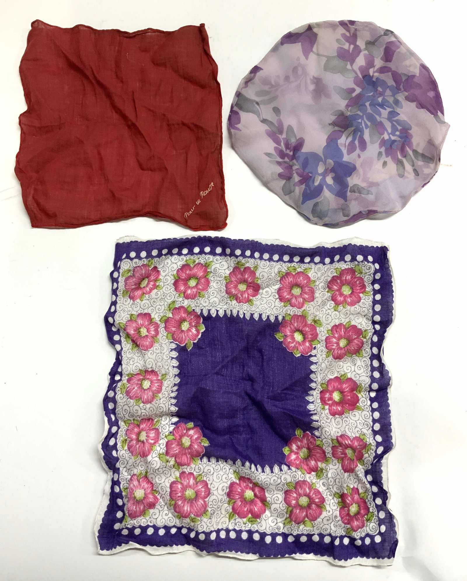 Lot 3 Handkerchiefs & More POUR VE ROUGE+: Lot includes 1 with purple, white, green & pink floral and leaf detail, 1 red toned & reads POUR VE ROUGE In one corner and 1 circular form, lavender purple and plum toned floral and leaf detail. Larg