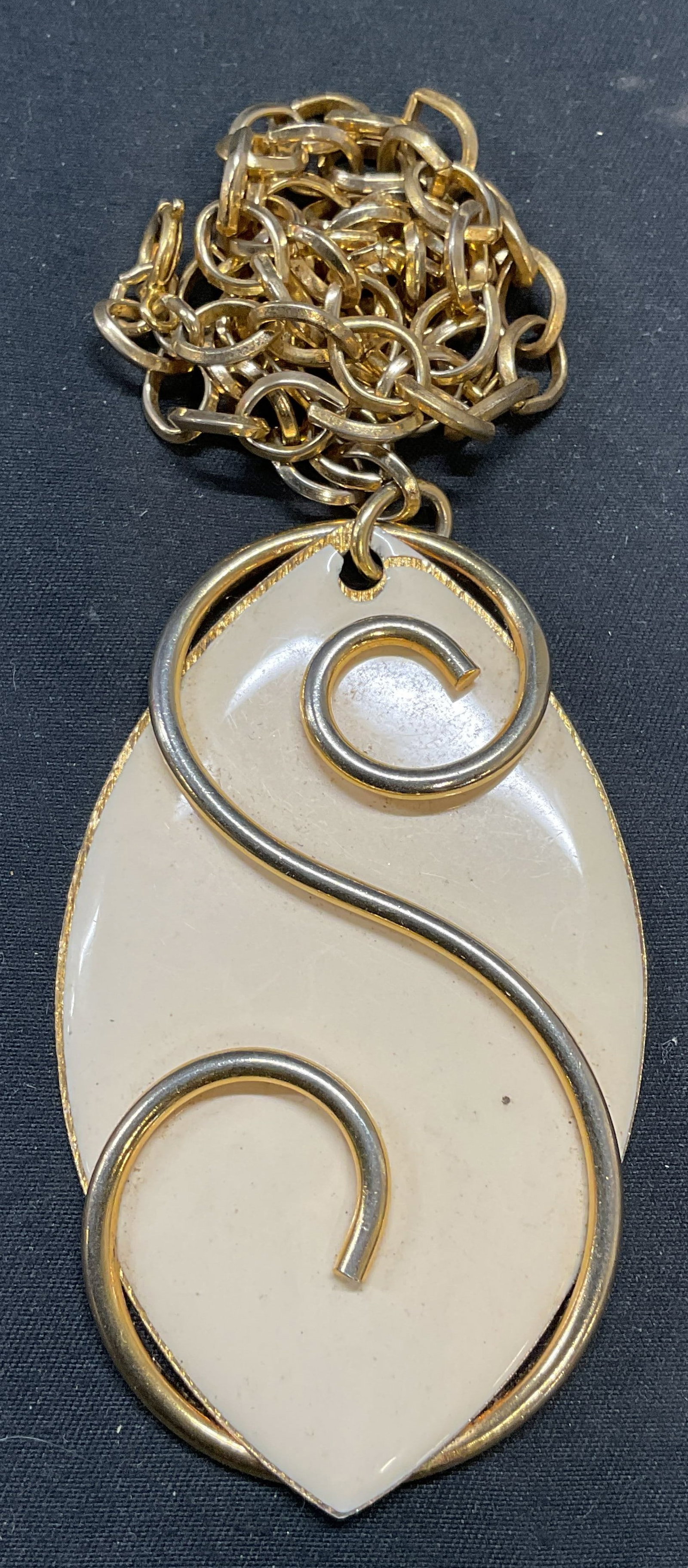 Vtg Gold Tone White Enamel Pendant Necklace: Vintage gold tone necklace with white enamel pendant. Drop length approx. 8 inches. Pendant measures approx. 3 inches long. Some surface wear including scratching observed. Jewelry, estate jewelry, co