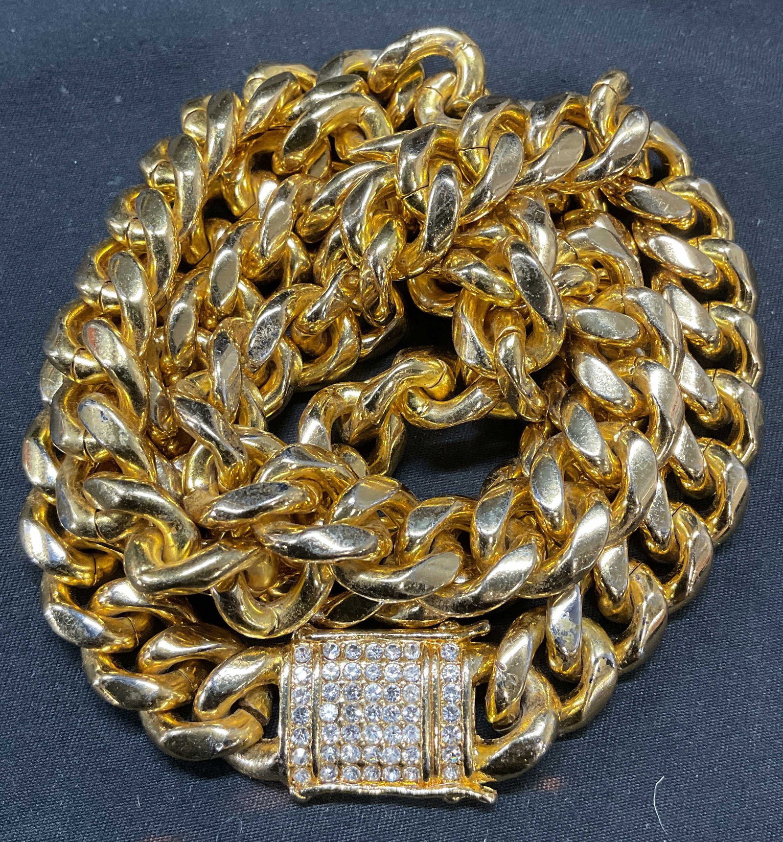 Gold Tone Crystal Chain Necklace: Gold tone curb chain necklace with colorless crystal decoration. Drop length approx. 14 inches. Piece is heavy. Some surface wear including scratching observed. Jewelry, estate jewelry, costume jewelr