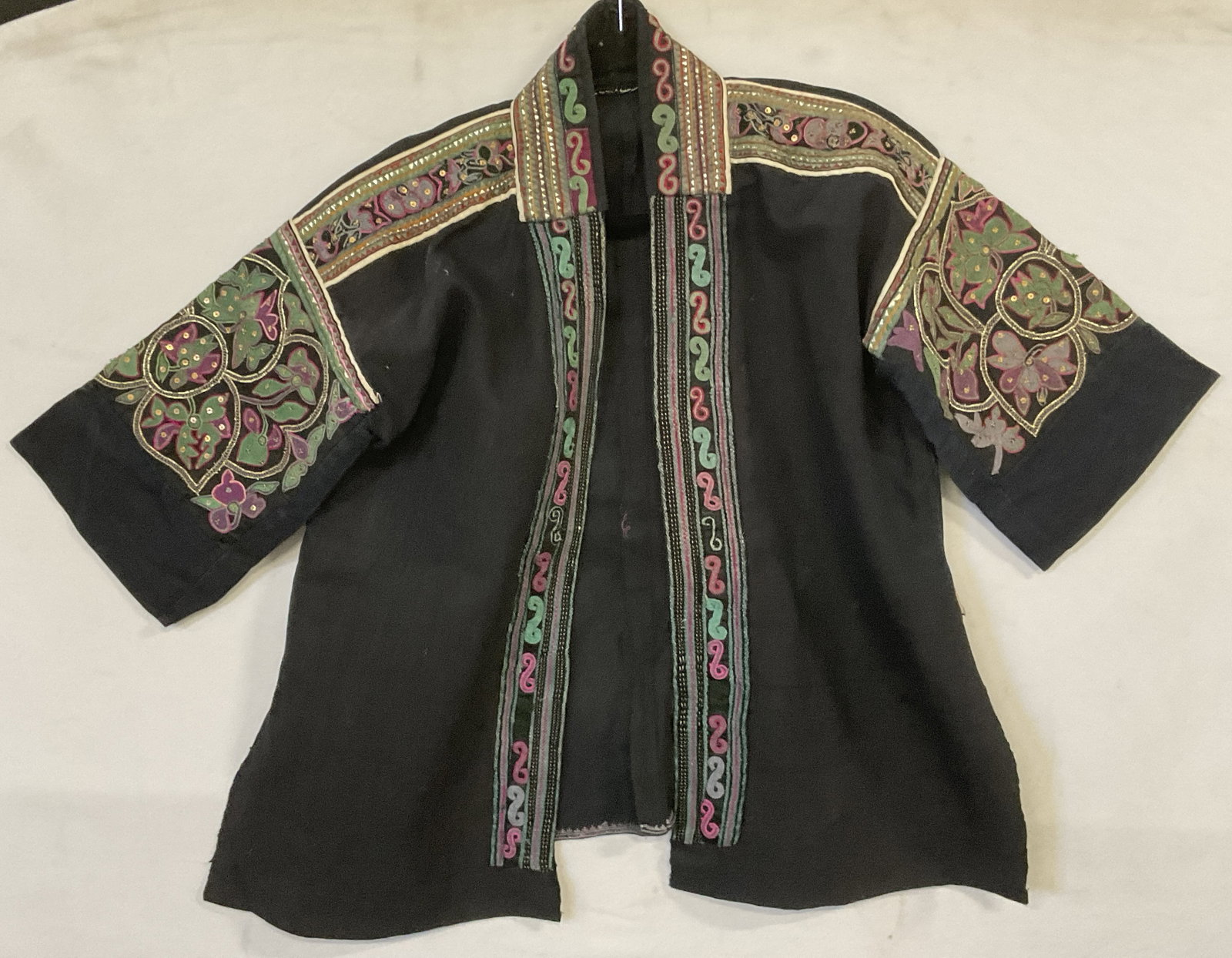 Vintage Floral Motif Embroidered Jacket: Vintage Floral Motif Embroidered Jacket. Black and dark blue base with colorful embroidery. No size tag. Length measures approx. 26 inches. Measured flat. Across chest measures approx. 22.5W in. Craft