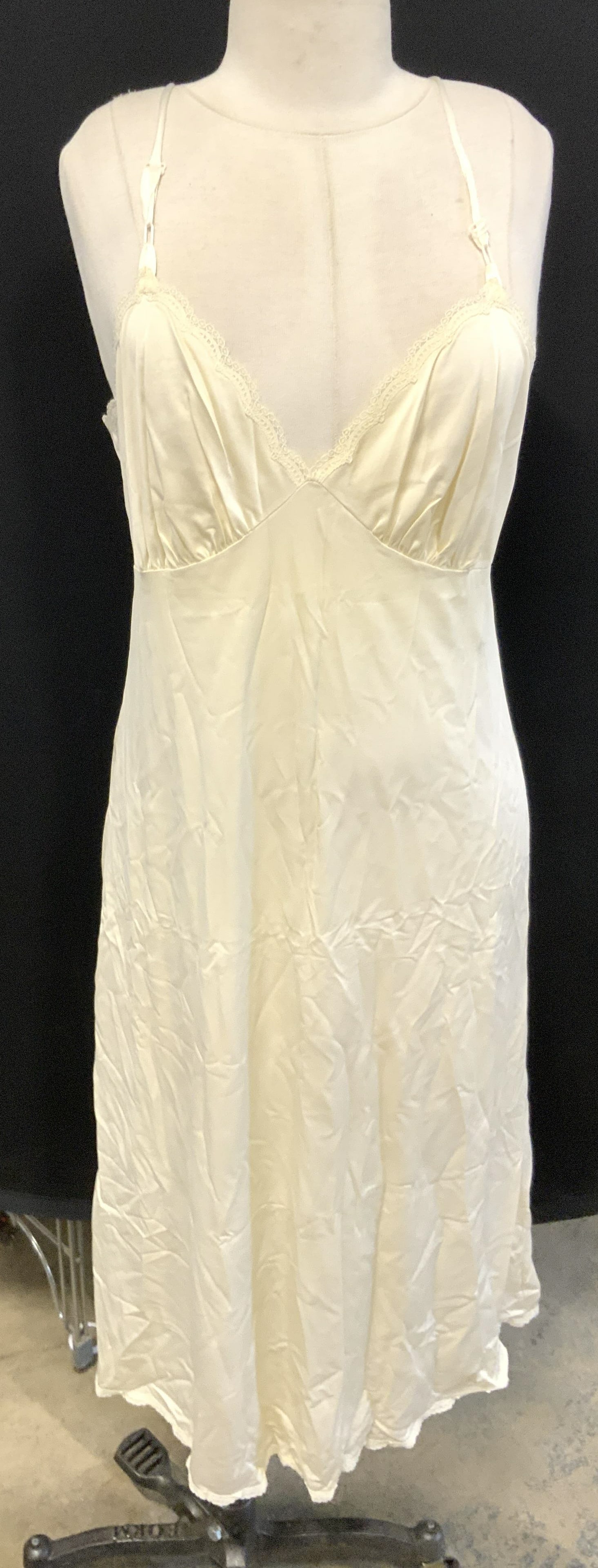 Cream Slip Dress Nightgown W Lace Edges: Slip is cream toned. Piece has lace detail at edges. Nightgown measures approximately 45 inches tall from strap to base. Appears to be size Med-Large Loungewear, nightgown, nightwear, nighty, slip, sl