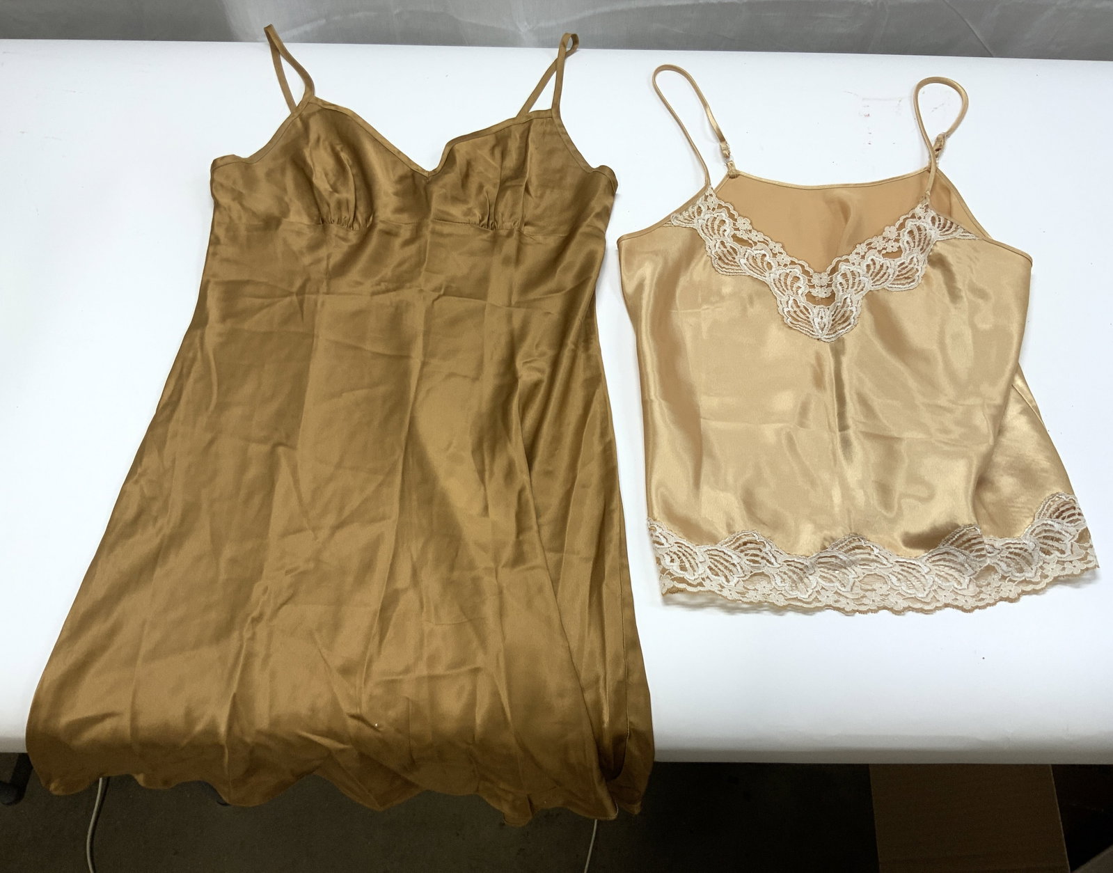 Lot 2 Slips LINDSEY ROSCOE & More: One slip has tag which reads LINDSEY ROSCOE Size M. Lot includes 1 beige & 1 gold toned. Shorter slip has lace detail at edges. Other slip size L & is 31.5 inches long from strap to base. Slip, nightg