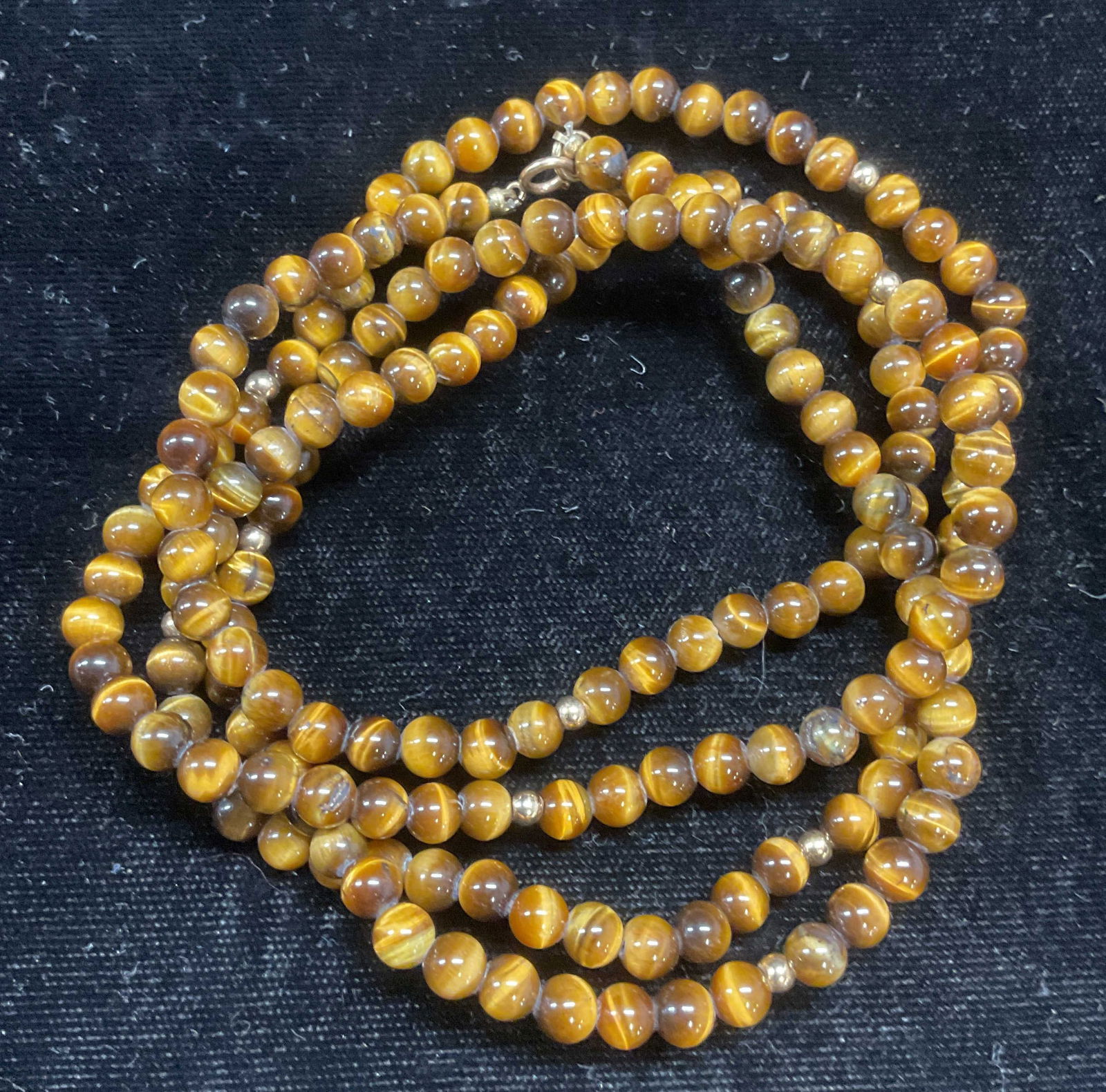 Gold Tone Tigers Eye Beaded Necklace: Tigers eye round beaded necklace with gold tone accent beads. Drop length approx 16.5 inches. Some wear including scratching observed. Jewelry, estate jewelry, fine jewelry, cocktail jewelry, fashion