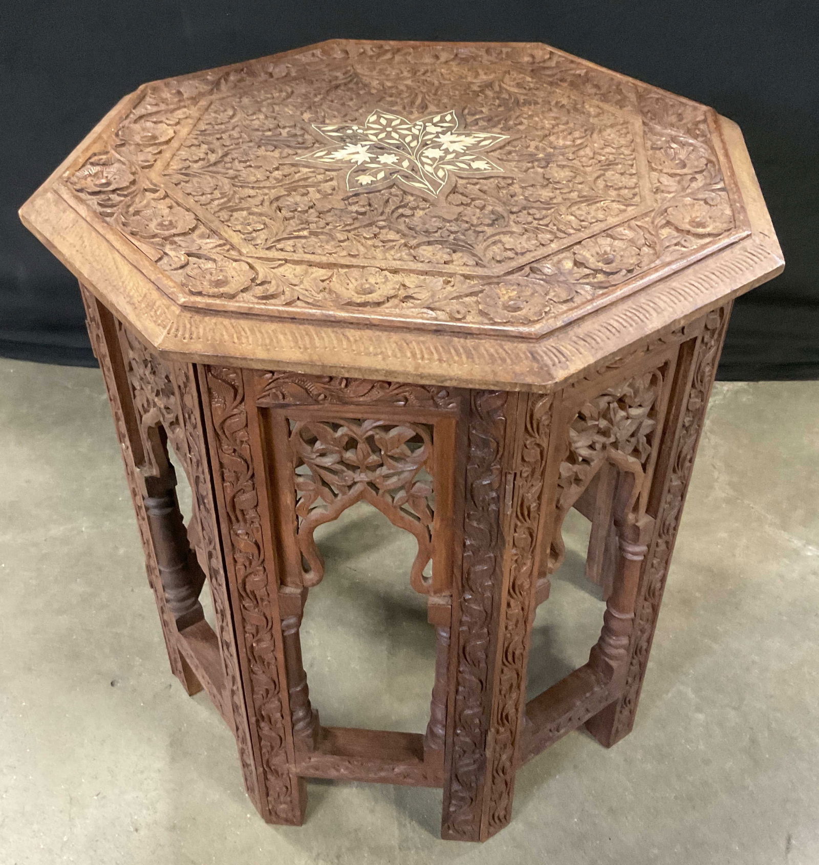 Vtg Carved Wood Bone Inlay Octagonal Side Table: Vintage Carved Wood Bone Inlay Octagonal Side Table. Measures approx. 15.5H x 16.5W in. Top is removable. Losses to inlay, wobble to piece, surface wear, and chipping present. Writing to underside, nu