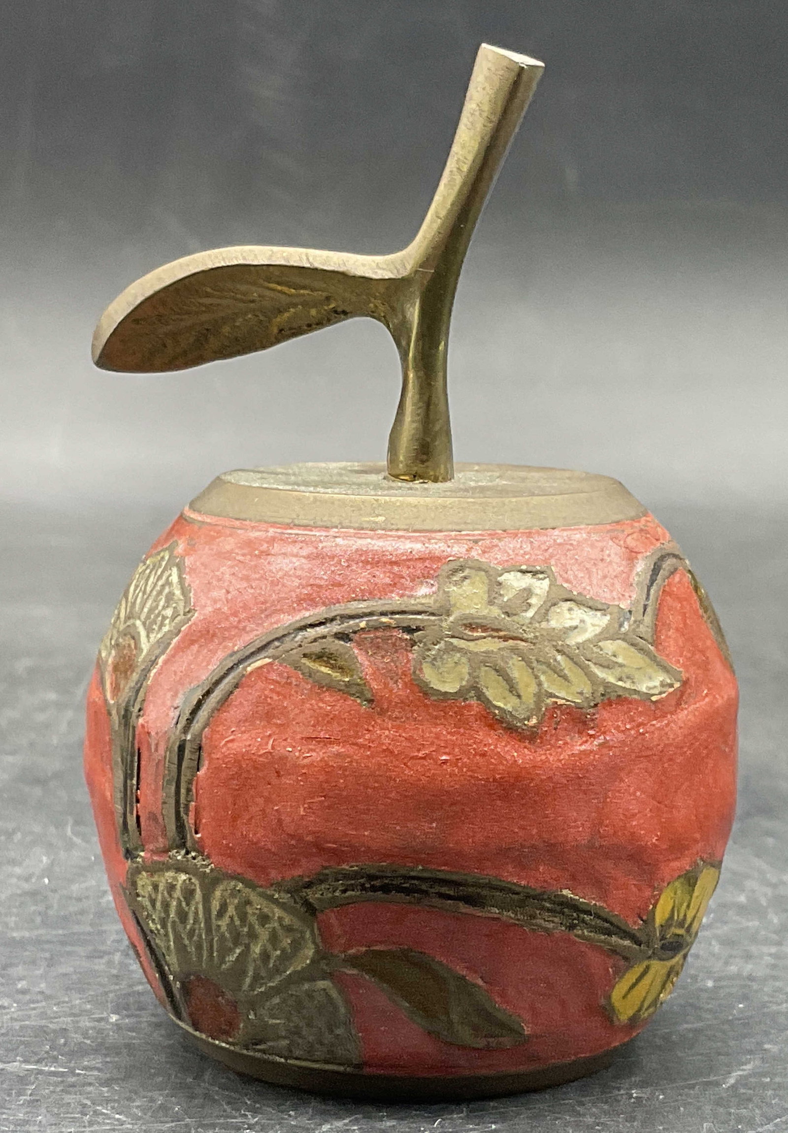 Vintage Enameled Metal Apple Form Bell: Vintage Enameled Metal Apple Form Bell. Floral and foliage motif to the sides. Measures approx. 3.25H x 2W in. Surface wear and discoloration present. home decor, home accents, homewares, housewares, 