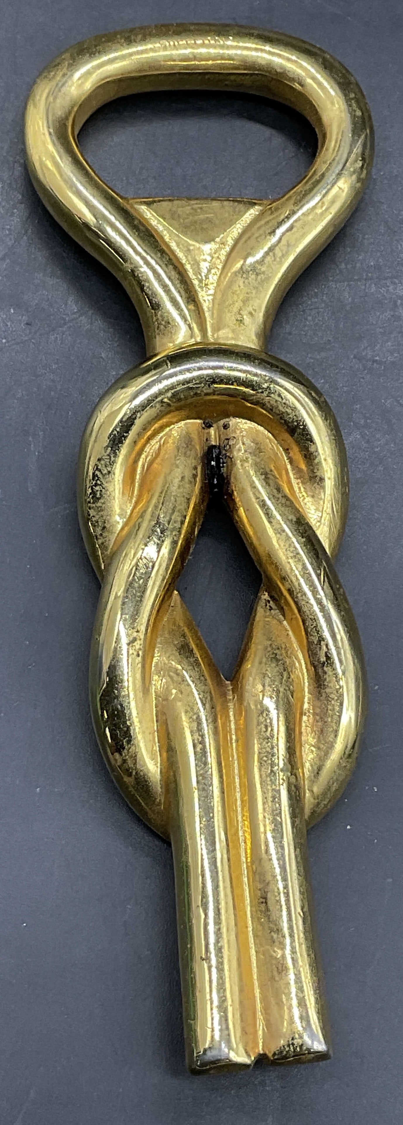 Brass Nautical Knot Bottle Opener, Barware: Brass Nautical Knot Bottle Opener. Measures approx. 5L x 1.5W in. Patina and surface wear present. home decor, home accents, homewares, housewares, home accessories, collectibles, Decorative arts, dec