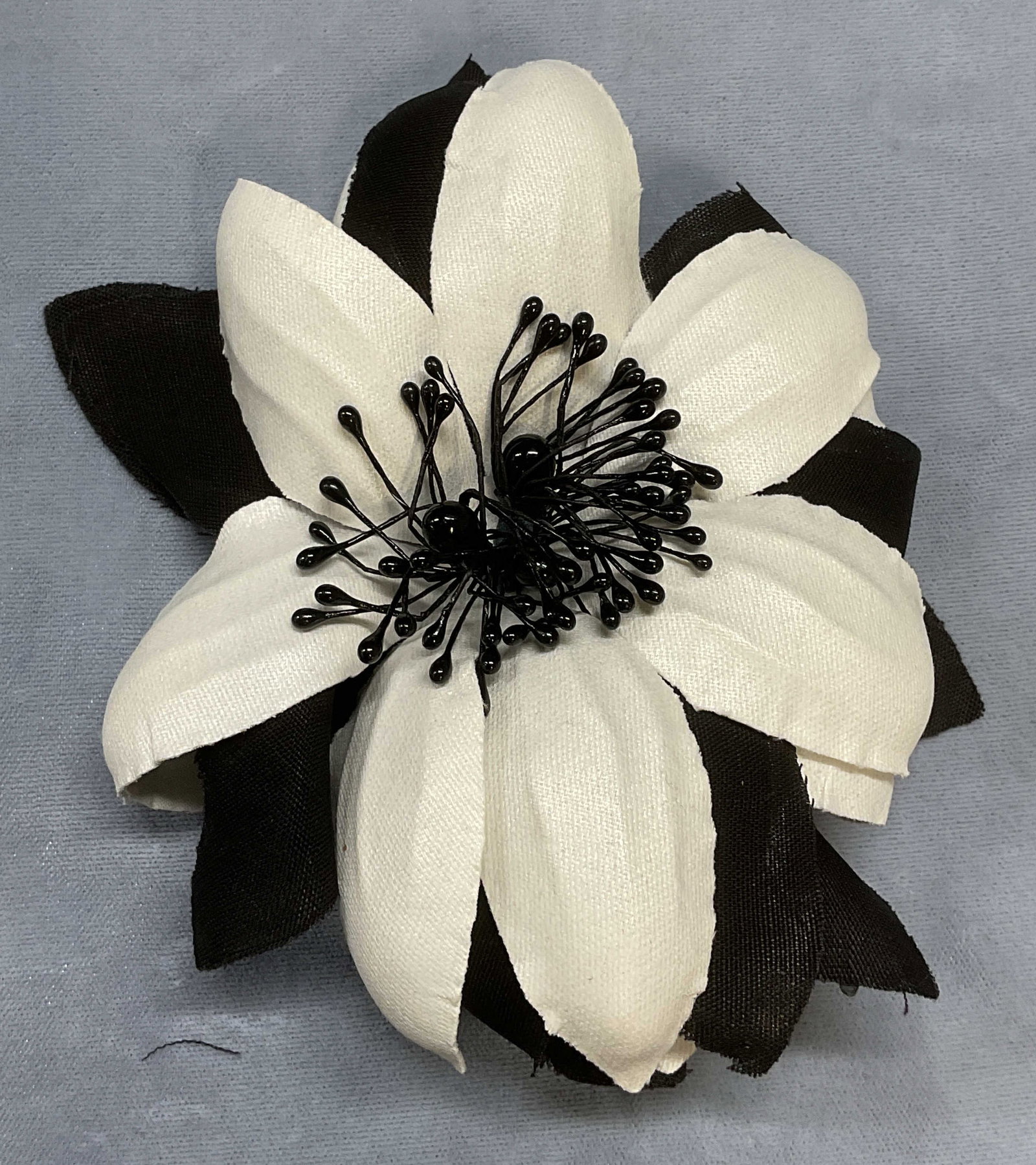 Vintage Black & White Flower Brooch, 5 Inches: Vintage black and white fabric flower brooch. Measures approx 5 inches long. Some wear including scratching observed. Jewelry, estate jewelry, costume jewelry, cocktail jewelry, fashion jewelry, acces
